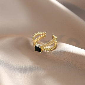 Anel Regulável com Zircônia Preta Folheado a Ouro 18K